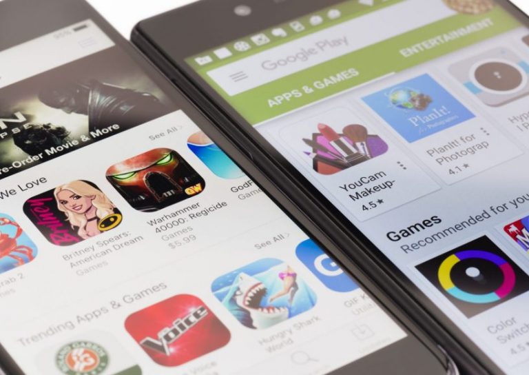 Google Play and Apple App Store Melbourne, Australia - May 23, 2016: Close-up view of Google Play Store on Android smartphone and Apple's App Store on iPhone. Both stores allow users to download app, music, movies and TV shows.