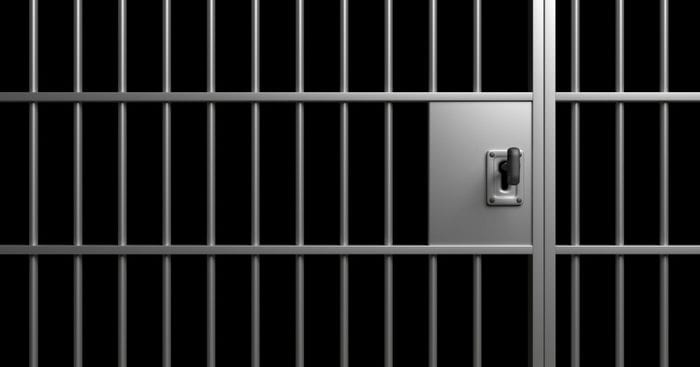 Prison interior. Jail bars and shadows, dark background. 3d illustration Prison bars. Jail bars and lock with a key, black background. Imprisoned, incarcerated, conviction concept, 3d illustration