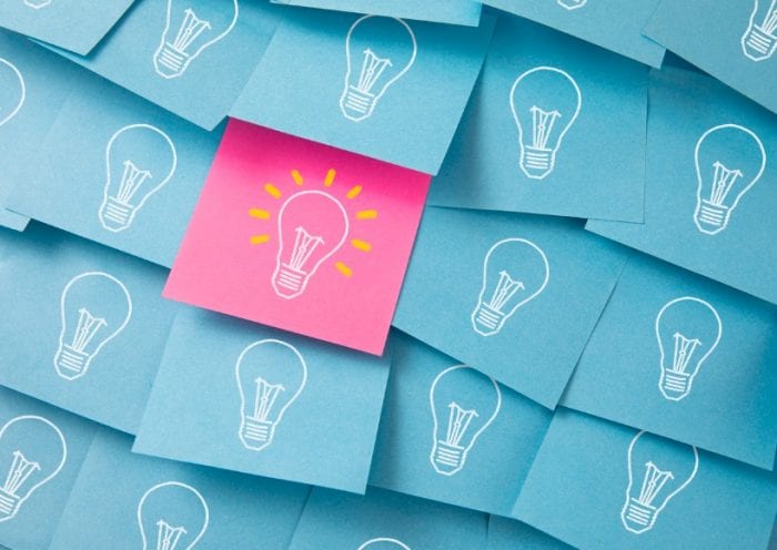 light-bulbs-drawn-on-colorful-sticky-notes-picture-id1226583757