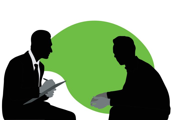 Therapist talking to his patient in this silhouette illustration