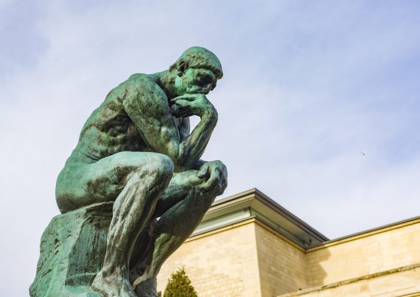 August Rodin's famous sculpture The Thinker in the grounds of the Musee Rodin, Paris