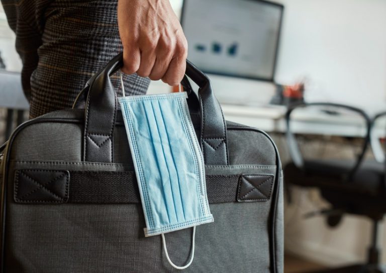 man-with-a-briefcase-and-a-surgical-mask-picture-id1221364691 man-with-a-briefcase-and-a-surgical-mask-picture-id1221364691