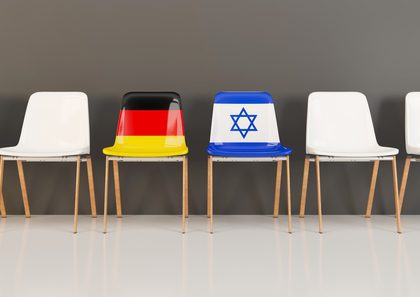 Chairs with flag of Germany and israel in a row German & Israeli flags on adjoining waiting room chairs