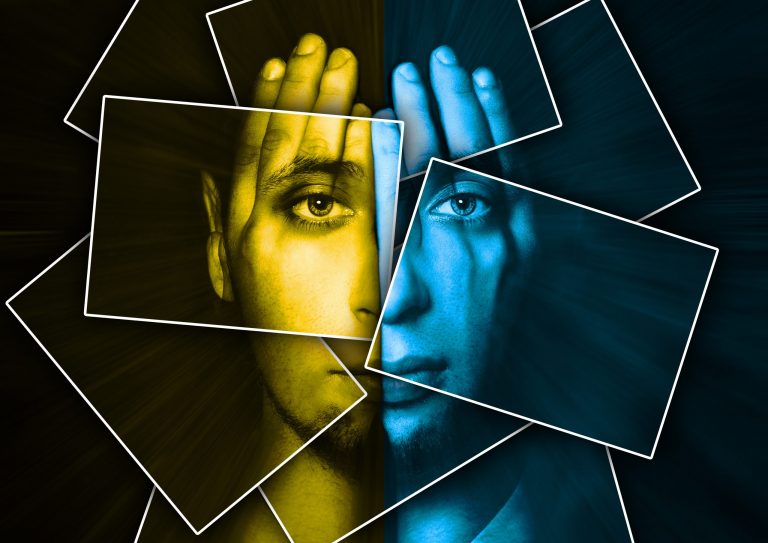 Face shines through hands, face is divided into many parts by cards , double exposure Double-sided human face, partly covered with hands.