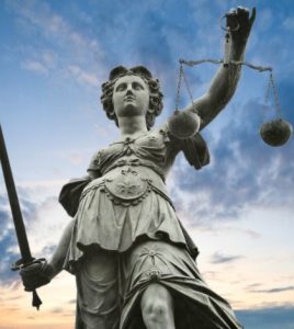 Lady Justice holding sword and scales.