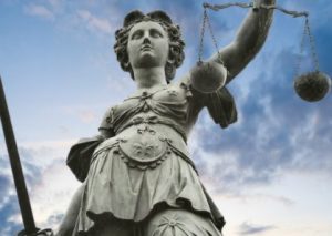 Lady Justice looking formidable, holding her sword and scales.