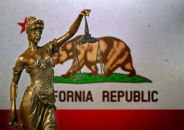 lady-justice-before-a-flag-of-california-picture-id1154922116