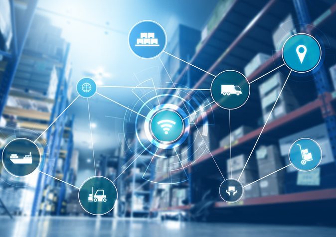 Smart warehouse management system with innovative internet of things technology Warehouse stocked shelves with "process" icons imposted over the image.