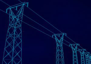 Electrical transmission towers at night.