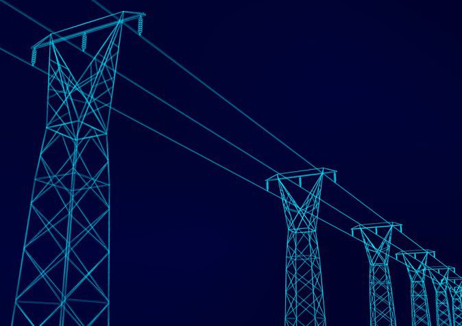 Electrical towers with wires Electrical transmission towers at night.