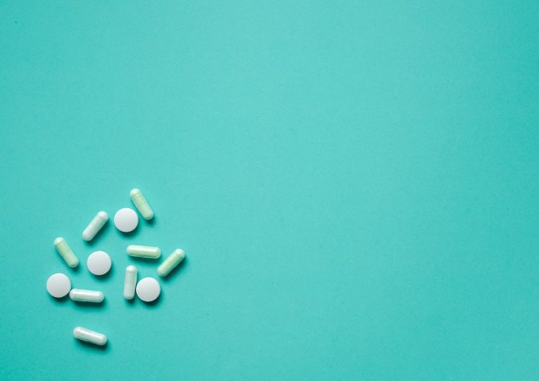 close-up-group-of-pill-medicine-on-teal-color-background-for-medical-picture-id1146968122 close-up-group-of-pill-medicine-on-teal-color-background-for-medical-picture-id1146968122