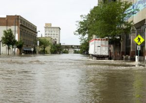 A commercial city street, flooded.
