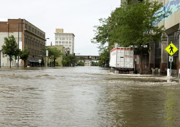 Flooded streets of an inner-city A commercial city street, flooded.