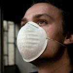 Person wearing a dust mask.