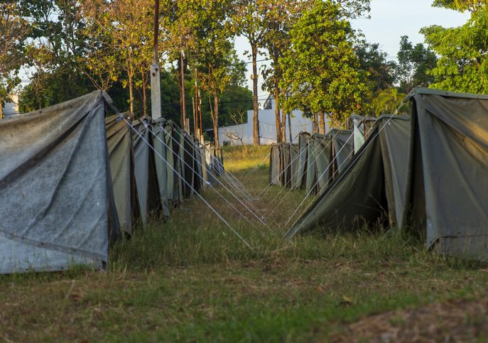 Line of tents at a campsite.