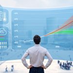 Man facing a large chart with a graph displaying environment-related data.