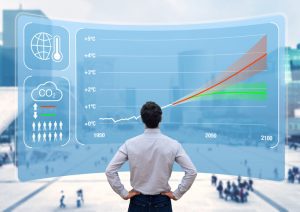 Man facing a large chart with a graph displaying environment-related data.