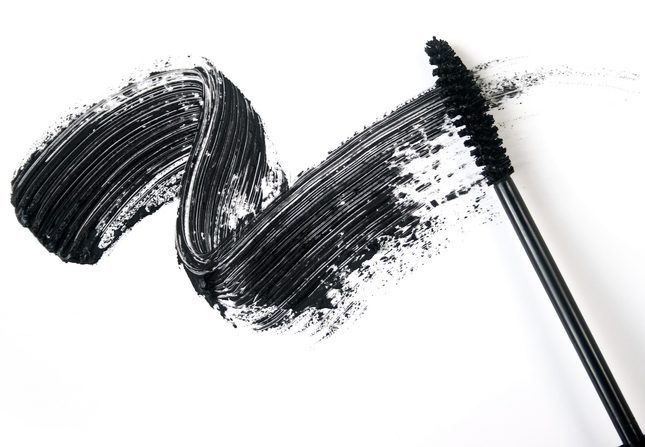 A smear of black eye liner from a mascara brush.