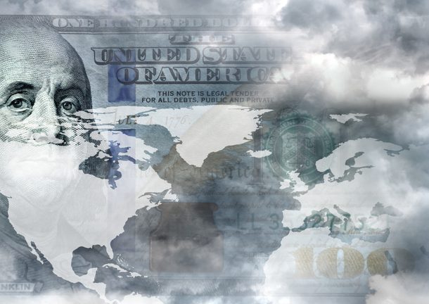 Clouds over part of a world map superimposed over a partial image of Ben Franklin on a hundred dollar bill.