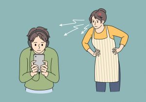 Cartoonish figure of woman wearing an apron looking askance at a young guy staring at his phone.
