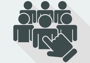 Abstract black & white illustration: finger pointing at one of a group of human shadow figures.