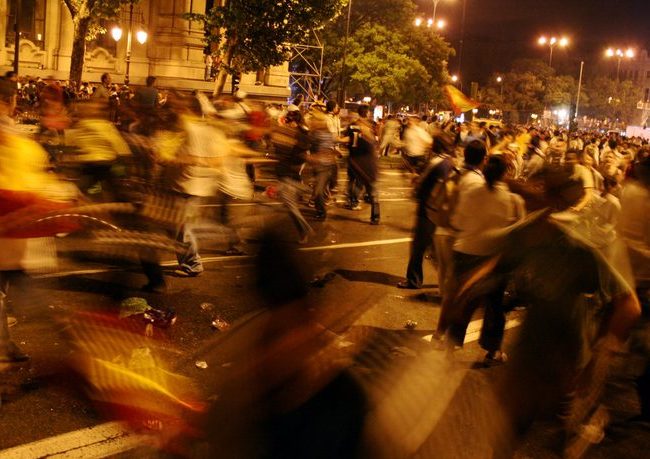 running in the night Night scene: demonstrating crowd in the street.