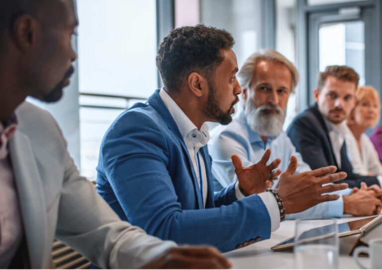 executive-team-listening-to-contrary-views-from-colleague-picture-id1272326797 executive-team-listening-to-contrary-views-from-colleague-picture-id1272326797