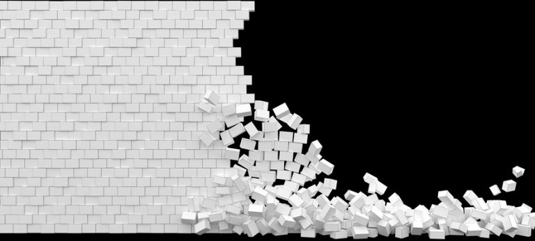 Broken white brick wall on a black background Brick wall partly demolished.