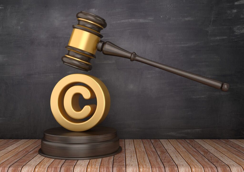 gavel-with-copyright-symbol-on-chalkboard-background-3d-rendering-picture-id1150933789