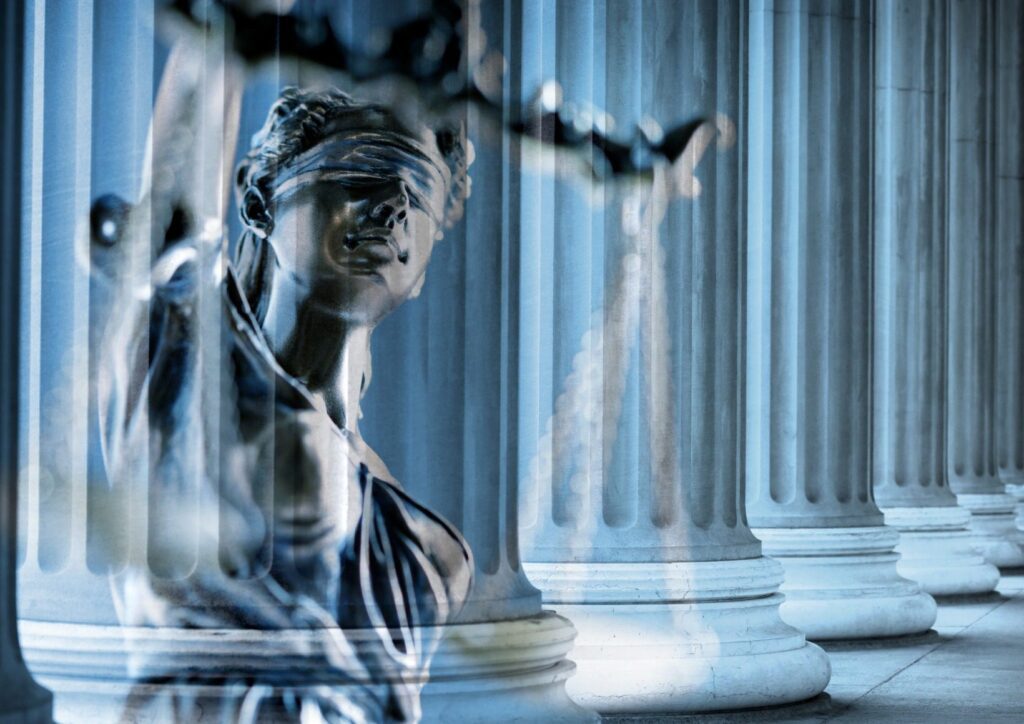 multiple-exposure-of-lady-justice-statue-and-greek-columns-picture-id964527302