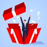 Cartoonish man figure bursting out of a colorful box.