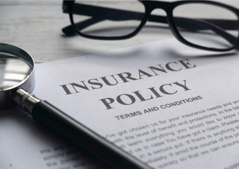 selective-focus-of-magnifying-glassglasses-and-insurance-policy-on-a-picture-id1295819436 selective-focus-of-magnifying-glassglasses-and-insurance-policy-on-a-picture-id1295819436