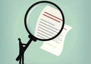 Ilustration of tiny black figure holding a giant mangifying glass over a piece of paper with lines of writing on it.