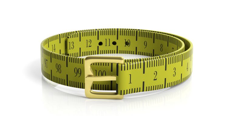An illustration of a measuring tape, shown in a circle as if it were a belt, with a belt buckle also shown.