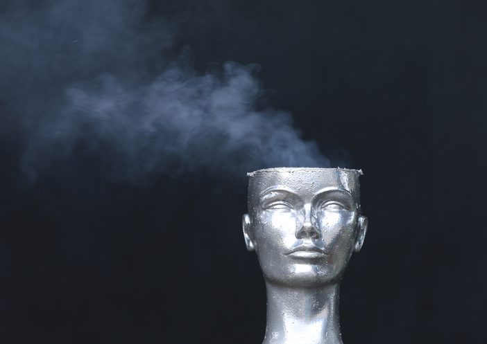 mannequin head smokes on black background Metallic renditon if a guy's head with the top sheared off and smoke coming out of it.