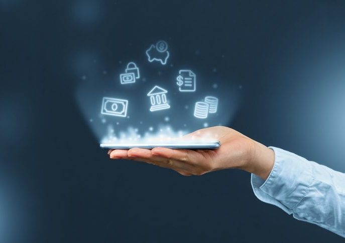 Person holds a smartphone with mobile banking icons projection. Illustration of a hand holding a cell phone, above which are icons symbolizing various kind of financial transactions