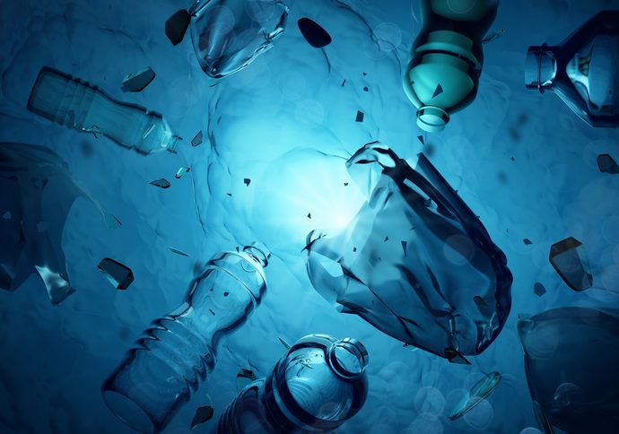Plastic refuse floating deep under the sea.