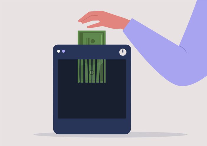 A hand putting a banknote into shredder, deflation, financial crisis, bankruptcy, money devaluation Illustration of someone putting money into a shredder
