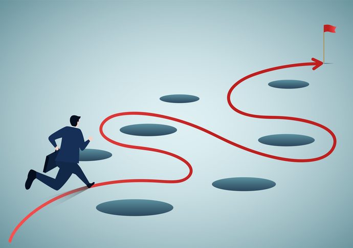 Avoid pitfall, adversity and keep away from mistake or business failure, skill and creativity to solve problem concept, smart businessman keep away from many pitfalls to achieve business success. Cartoon-like illustration of a guy following a circuitous red path that winds around dark holes.