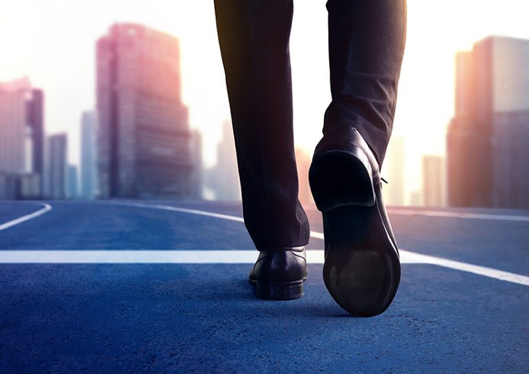 gc-departure business person walking on road