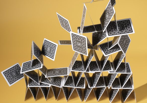 playing cards tower A house of cards collapsing.