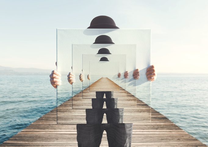 surreal enigmatic picture on canvas Surreal illustration of a disjointed figure hold successive images, as he stands on a dock that vanished into the distance.