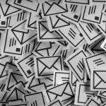Stylized illustration of part of a huge pile of envelopes.