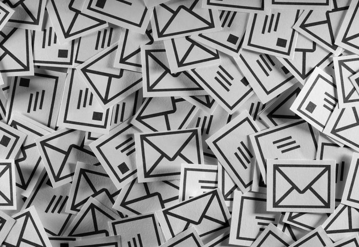 Spam Stylized illustration of part of a huge pile of envelopes.
