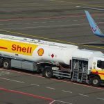 Shell oil tank truck on an airport runway.