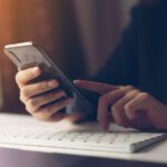 businessperson looking at phone