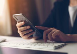 businessperson looking at phone