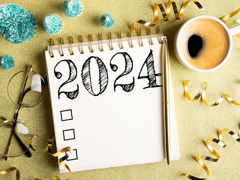 New year reminder for general counsel concept, 2024 goals list on notebook